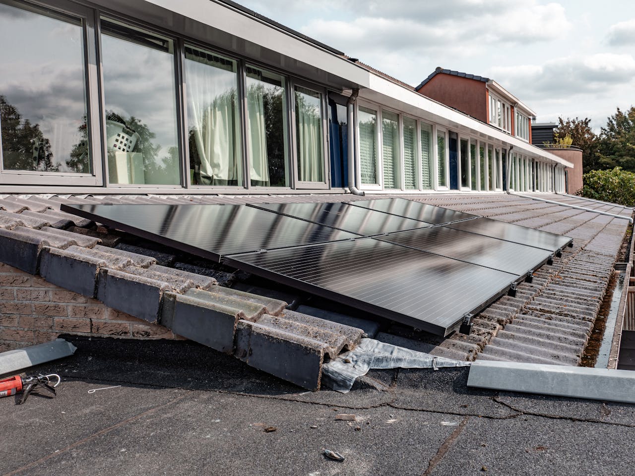 Home Rooftop solar panels on a modern house, optimizing energy efficiency.